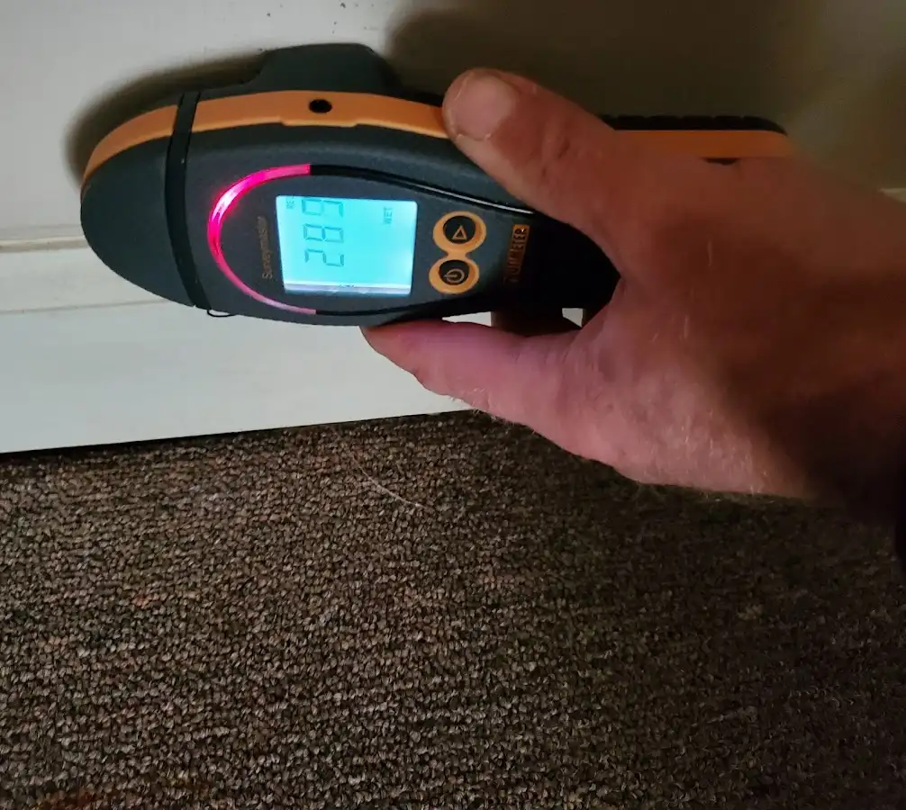 Moisture detection at baseboard during Storm Damage Restoration in Moab